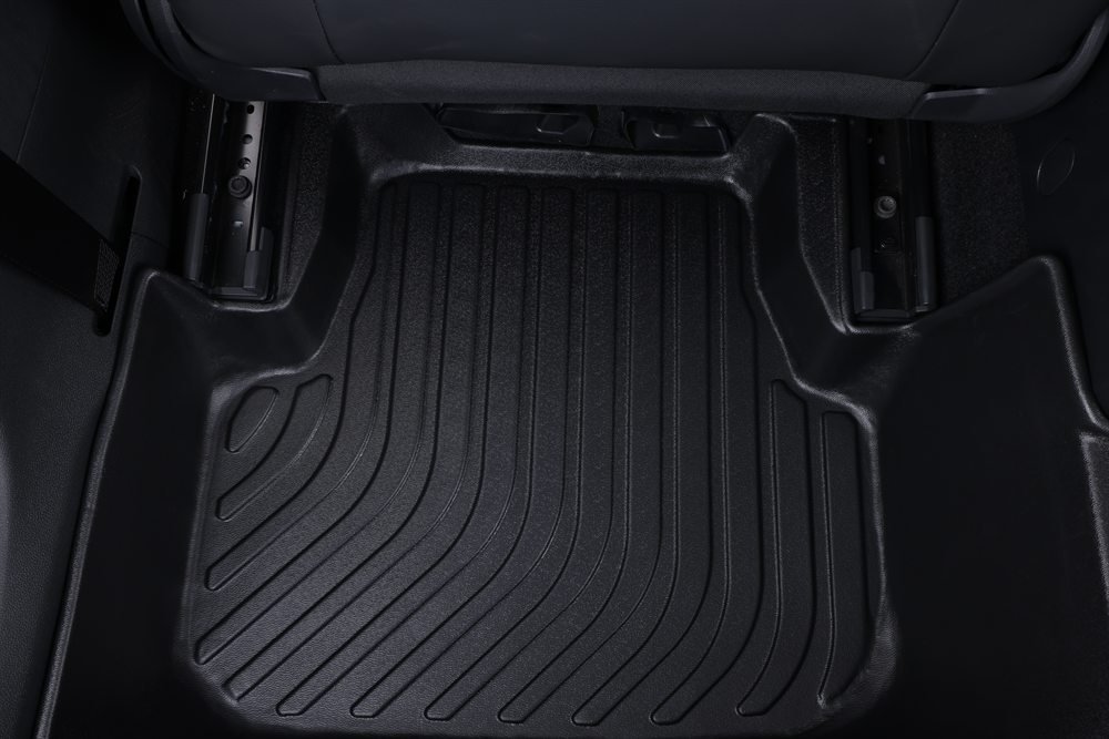 Raised edge and waterproof channel detail of TPE floor mat